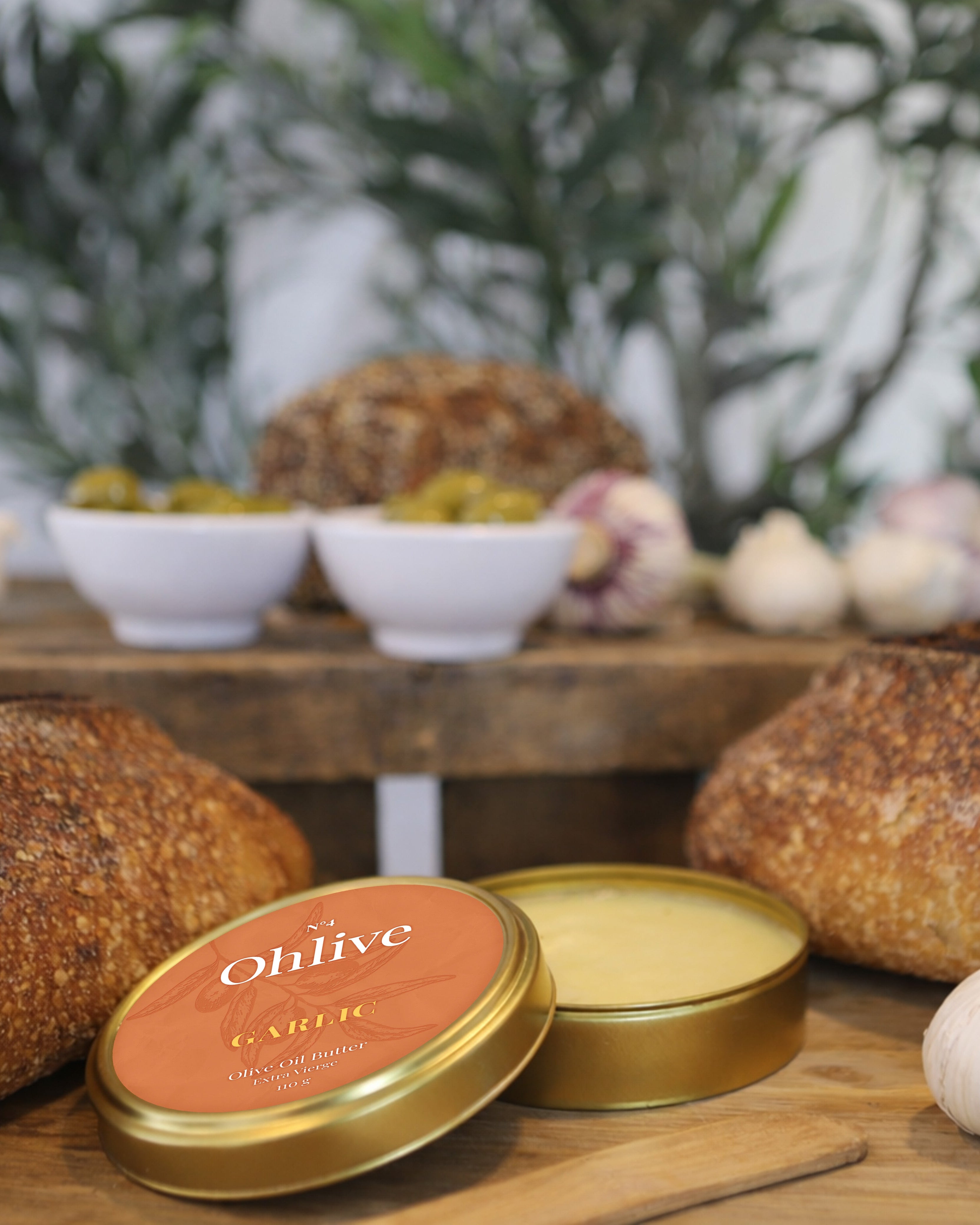 garlic olive oil butter served with artisanal bread and fresh garlic