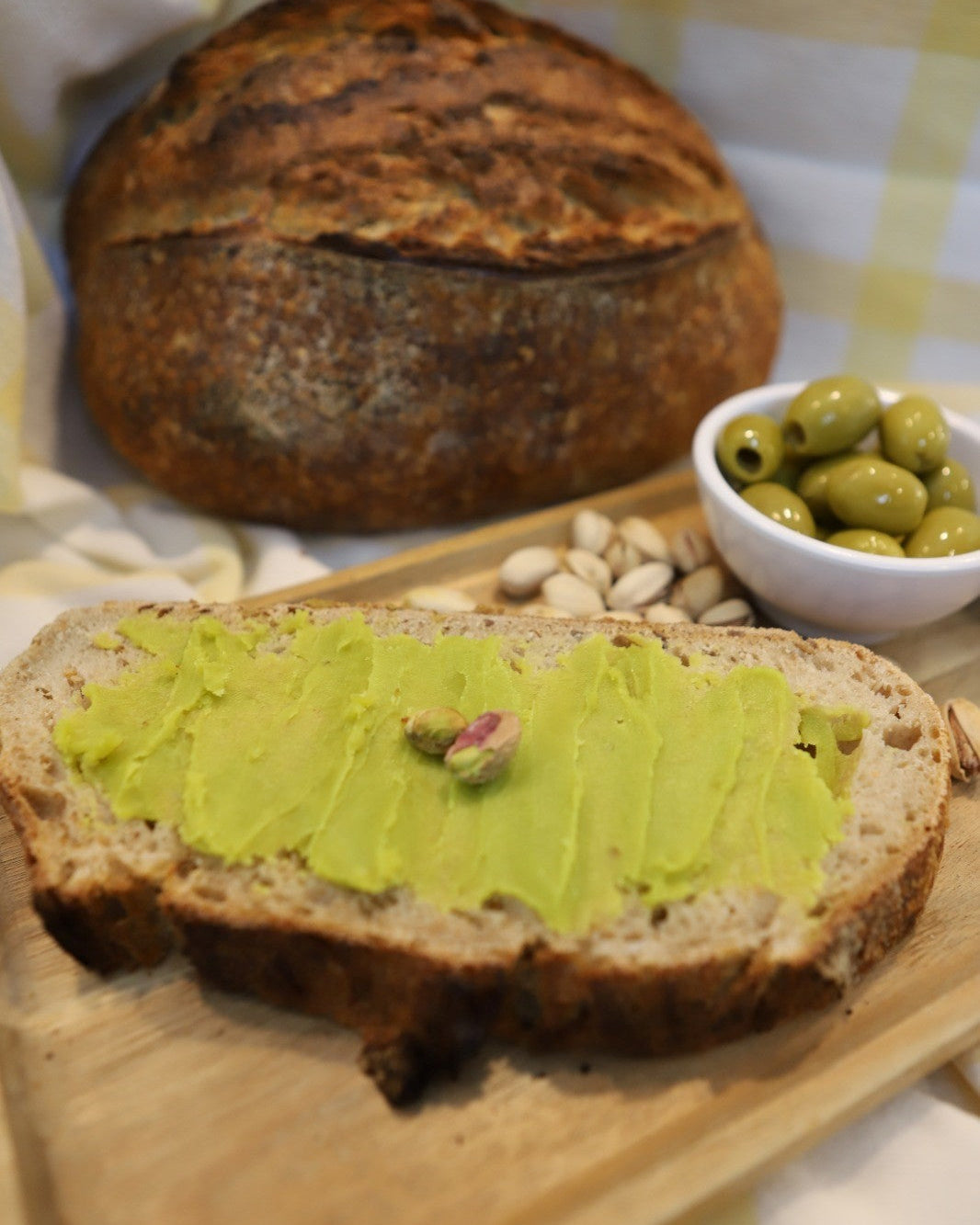 pistachio olive oil butter served with artisanal bread and pistachios