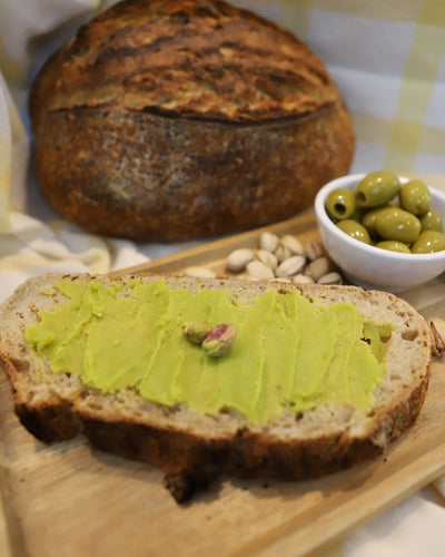pistachio olive oil butter served with artisanal bread and pistachios